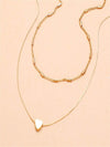 Goldenes herzanhänger collier - elegante, geschichtete damenmode