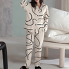 2-teilige pyjama kombination - stilvolles beige-schwarz abstraktes design für damen