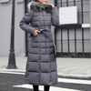 Langer gepolsterter mantel - stilvolle damen winterjacke mit kunstfellkapuze